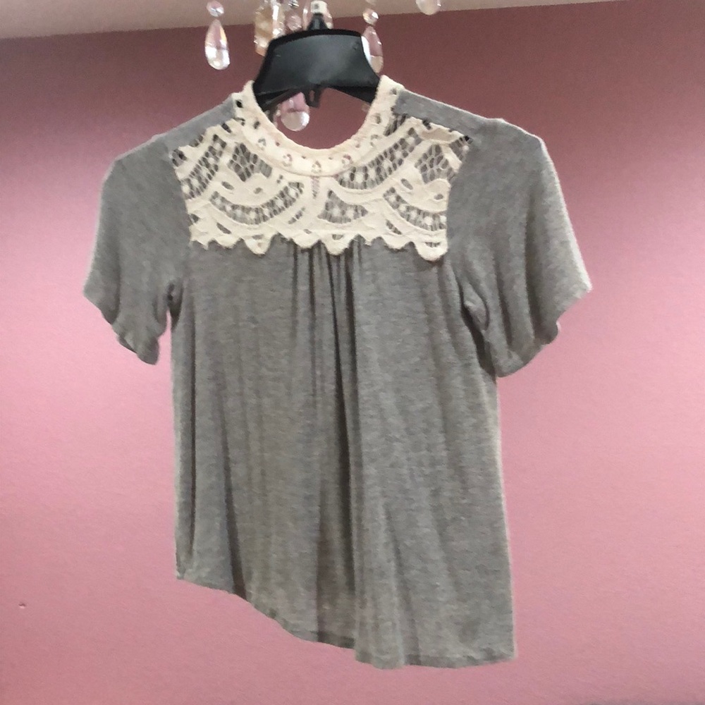 Gray shirt button up on back